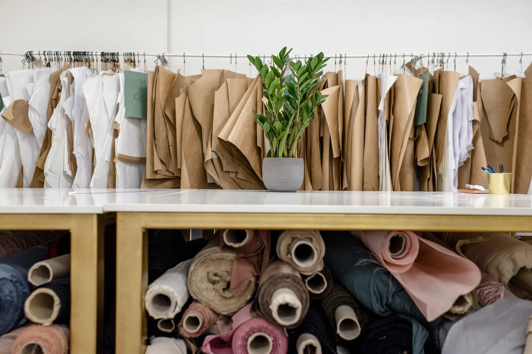 Patterns and textiles arranged in a fashion atelier.